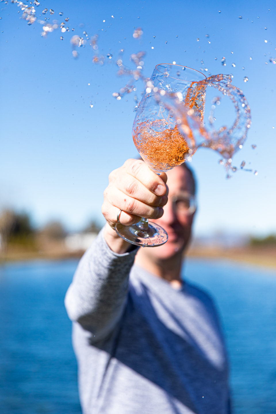 Man Splashing Rosé Wine